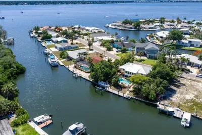 Waterfront island living at its best. Enjoy direct canal access, stunning water views, and a peaceful tropical setting just minutes from the beach — the perfect escape for boating, relaxing, and unforgettable Florida memories!