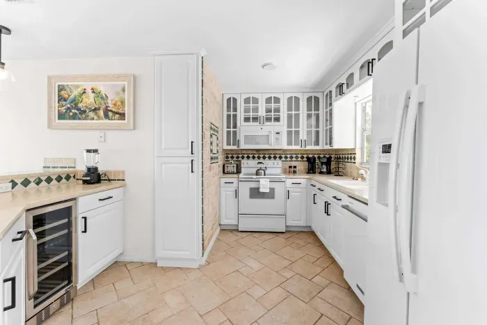 Bright and spacious chef’s kitchen. Fully equipped with everything you need for family meals, snacks, and vacation gatherings — plus a built-in wine cooler for relaxing evenings after a fun day by the water!