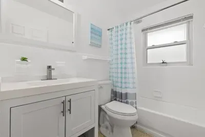Full bathroom with shower and bath tub.