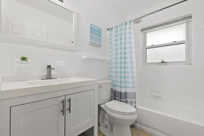 Full bathroom with shower and bath tub.