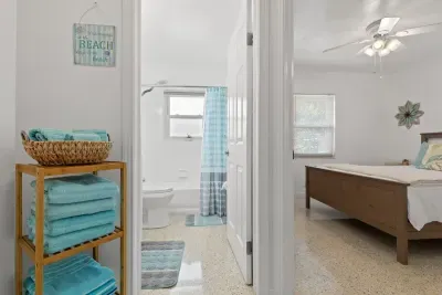 Full bathroom (shower and tub) and bedroom.