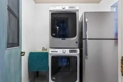 Enjoy the comfort of home with a modern washer and dryer set, perfect for extended stays or sandy beach days. Plus, an extra full-size fridge gives you all the space you need for groceries, drinks, and leftovers—ideal for families or group travelers.