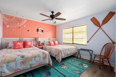 Step into a seaside sanctuary where playful decor meets comfort. Perfect for families or groups, the room is both spacious and cozy—ideal for unwinding after a day at the beach or exploring the local area.