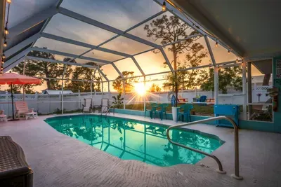 Unwind in your own private screen-enclosed pool oasis, where the sunsets paint the sky and twinkle lights set the mood.