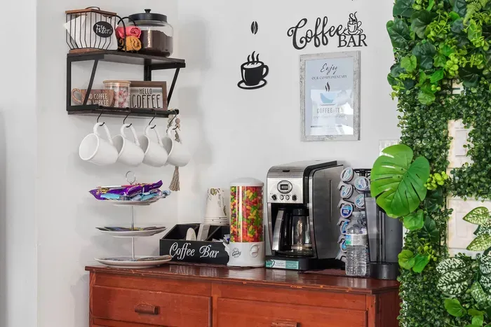 Start your mornings right at our cheerful in-house coffee bar! Featuring a variety of brewing options, including a single-serve Keurig and traditional coffee maker, this cozy corner is fully stocked with mugs, creamers, teas, and snacks.