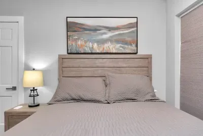 A comfy queen-bed to lay your head after a day of adventure.