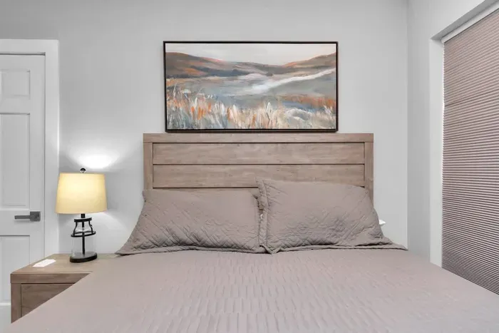 A comfy queen-bed to lay your head after a day of adventure.