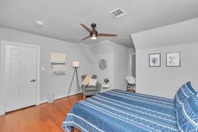 Spacious queen-size room with a little corner to take work calls or finish sending out emails.