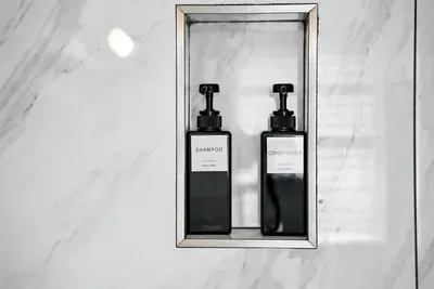 Indulge in  with our spa-inspired shower, featuring sleek marble walls and premium refillable toiletries. Thoughtfully designed for elegance and eco-friendliness, every detail elevates your stay.