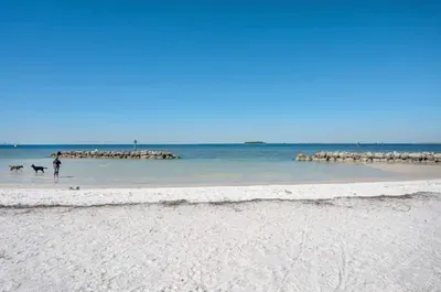 Relax on this serene white-sand beach with crystal-clear waters and gentle waves. Perfect for sunbathing, swimming, or a peaceful walk along the shore—your ideal coastal escape just minutes from your stay.