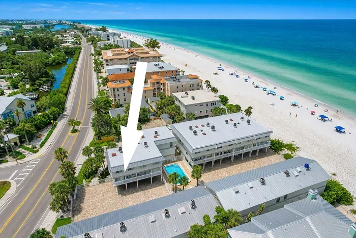 This is exactly where you land. Gulf side of Gulf Blvd, emerald water out the front, no road between the villa and the sand.