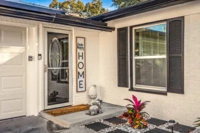 Step into a warm welcome with this charming home entrance, featuring stylish shutters, inviting décor, and thoughtful details. A cozy first impression that sets the tone for a comfortable, relaxing stay from the moment you arrive.