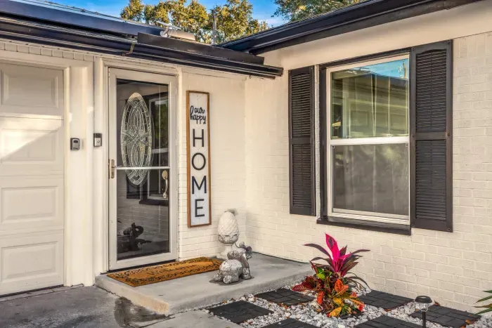 Step into a warm welcome with this charming home entrance, featuring stylish shutters, inviting décor, and thoughtful details. A cozy first impression that sets the tone for a comfortable, relaxing stay from the moment you arrive.