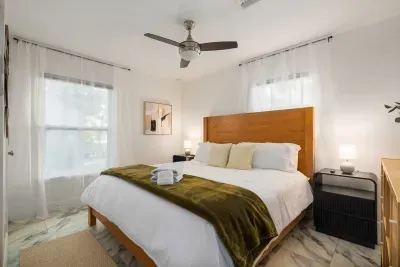 Unwind in this bright, inviting bedroom with a comfortable bed, soft linens, and natural light throughout. A peaceful space designed for rest, relaxation, and a great night’s sleep.