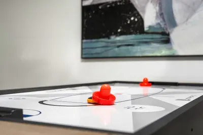 Enjoy friendly competition on the sleek shuffleboard table, perfect for game nights and casual fun. A great way to unwind, connect, and add a little excitement to your stay.
