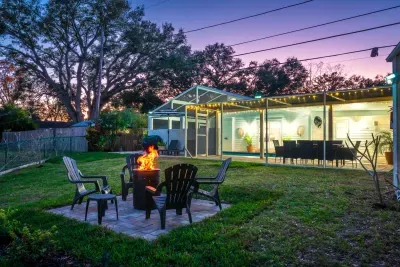 Gather under the string lights for cozy nights around the fire pit, surrounded by open green space and tranquil views.