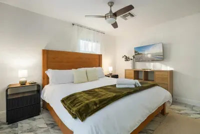 Relax in this serene bedroom featuring a plush bed, crisp linens, and calming décor. Thoughtfully designed for comfort, it’s the perfect retreat to unwind and recharge after a day of adventure.