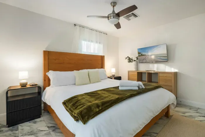 Relax in this serene bedroom featuring a plush bed, crisp linens, and calming décor. Thoughtfully designed for comfort, it’s the perfect retreat to unwind and recharge after a day of adventure.