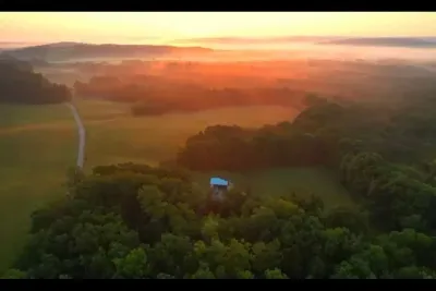 A peaceful bird’s-eye view of the meadow where The Haven rests — tucked away in nature, surrounded by stillness and sky.