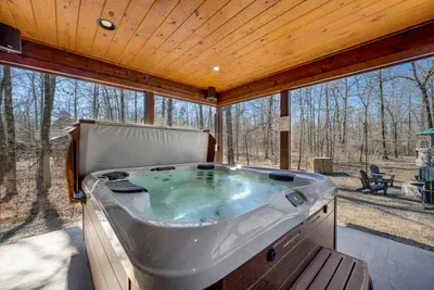 Hot Tub Retreat: Soak up nature's beauty while relaxing in your private haven. Cheers to tranquility!