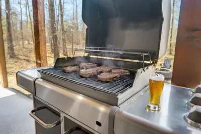 Outdoor Grill: Sizzle delicious steaks while enjoying nature's backdrop and a cold brew!