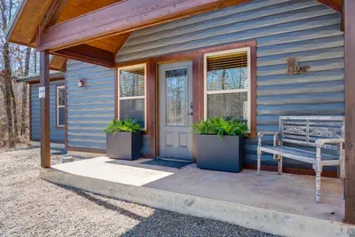 Charming Exterior: Relax on the porch and soak in nature's beauty at every turn!