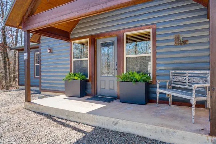 Charming Exterior: Relax on the porch and soak in nature's beauty at every turn!