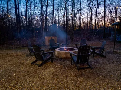Fire Pit Haven: Gather around the flickering flames beneath the stars in serene nature!