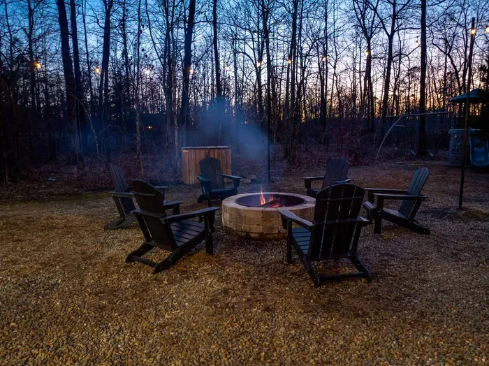 Fire Pit Haven: Gather around the flickering flames beneath the stars in serene nature!