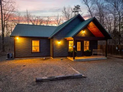Exterior Retreat: Embrace nature with stunning sunset views and inviting rustic charm!
