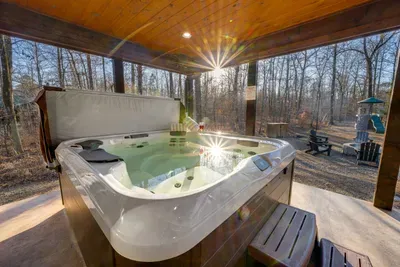 Hot Tub Oasis: Relax in the tranquil spa, surrounded by nature and stunning views!