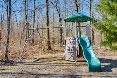 Playground Paradise: Adventure awaits with climbing walls and slides surrounded by nature!