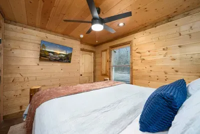 Bedroom Oasis: Relax in a sunlit retreat with rustic charm and sleek comfort!