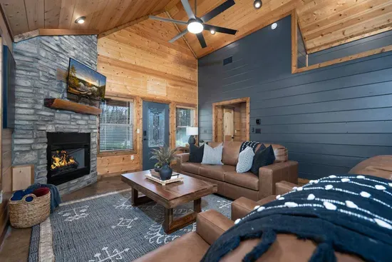Living Room: Elegant leather seating, pull-out couch to that turns into a bed and a warm fireplace set the stage for memorable gatherings!