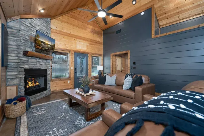 Living Room: Elegant leather seating, pull-out couch to that turns into a bed and a warm fireplace set the stage for memorable gatherings!