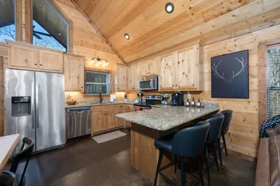 Gourmet Kitchen: Enjoy culinary adventures in this stylish, well-equipped space with stunning wood accents!