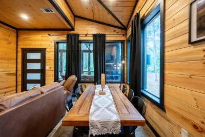 Dining Area: Gather around the handcrafted table, with views of nature just outside the windows!