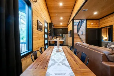 Dining Room: Gather around the stunning wood table, surrounded by nature's beauty!