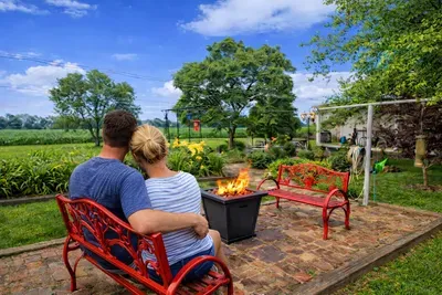 Cozy garden patio with fire pit and countryside views—relax and unwind.