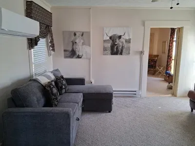 Cozy lounge with sectional, artful decor & AC, bright and quiet