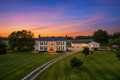 Stately country estate with sunset views, guesthouse & sweeping lawns.