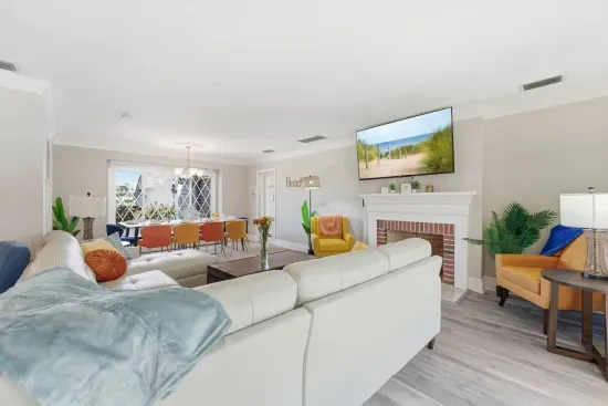 Settle onto the sofa with a view straight through to the dining table, keeping everyone in the conversation.