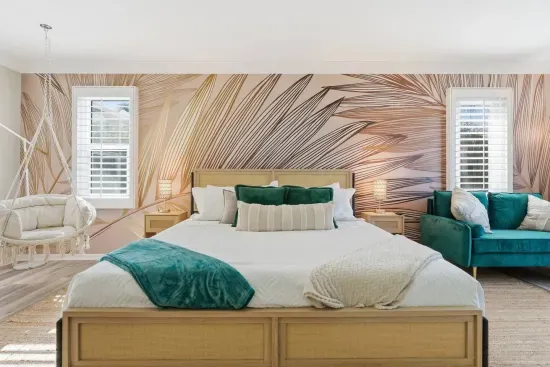 Wind down in the tropical suite as evening light fills the room and the hanging chair calls your name.