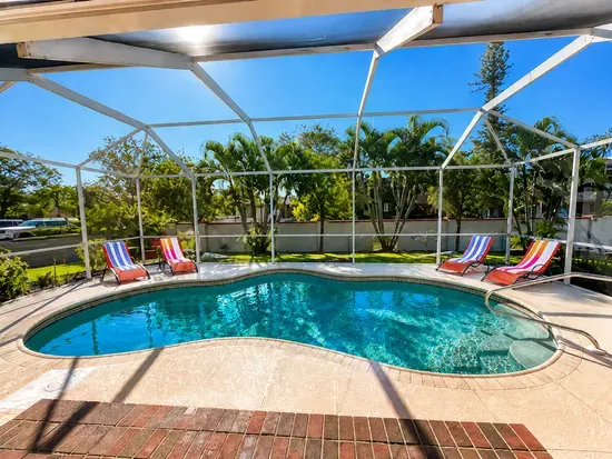 Ease into the pool at golden hour, flamingo float in reach and a sherbet colored sky overhead.