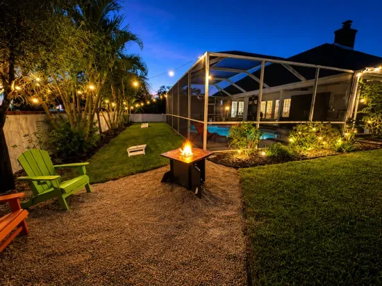 Watch the flames dance at the fire pit while string lights twinkle through the trees overhead