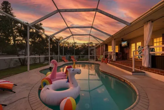 Watch the sky turn pink and orange from the screened pool as the day winds down.