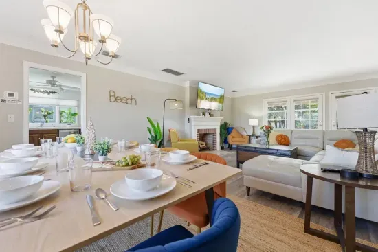 Sit down together at the dining table for a family meal within view of the fireplace and TV.