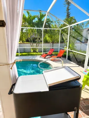 Keep drinks cold in the poolside cooler cart and settle into a lounge chair for an easy afternoon by the wate