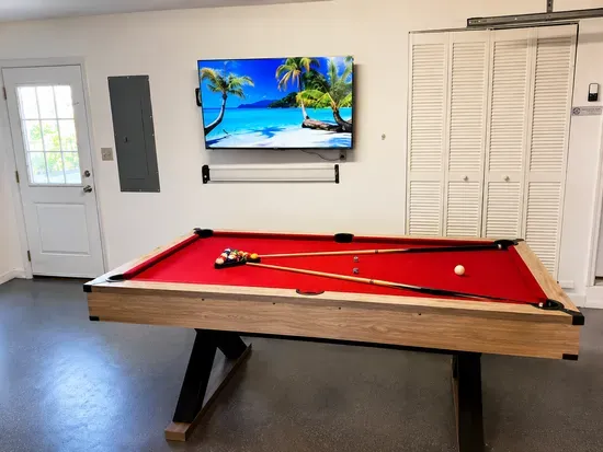 Break out the cue sticks for a pickup game of pool, then relax on the sofa while you wait your turn.