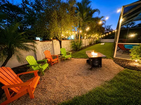 Pull a chair up to the fire pit as dusk settles in and the string lights start to glow